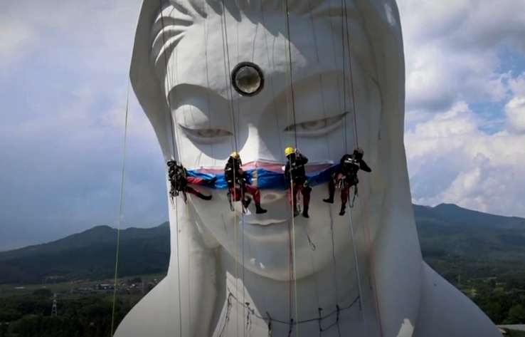 Giant Buddhist goddess in Japan gets face mask to pray for end of COVID-19