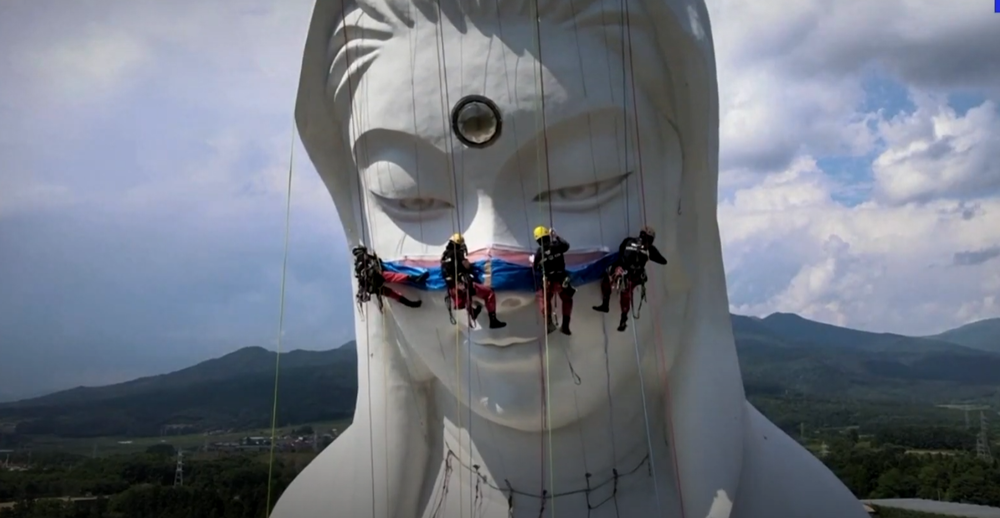 Giant Buddhist goddess in Japan gets face mask to pray for end of COVID-19