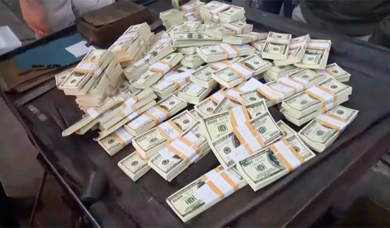 Около миллиона фальшивых долларов сожгли в Алматы