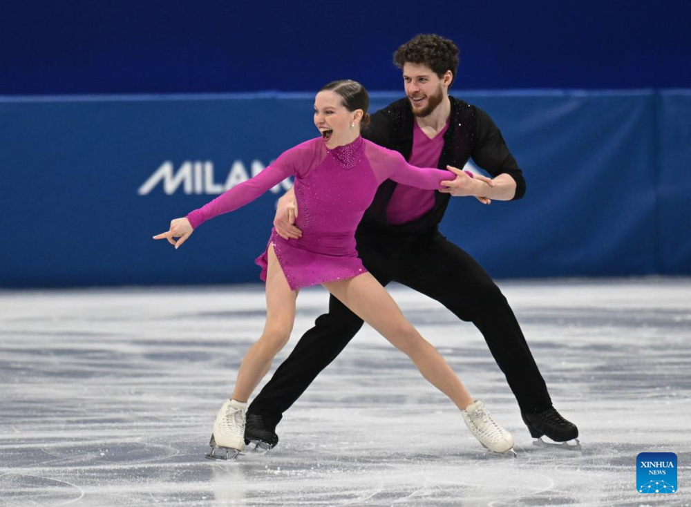 Highlights of Milan-Cortina 2026 on Feb. 6. Images | Ioulia Chtchetinina (L)/Michal Wozniak of Poland compete during the figure skating team event pair skating short program of the Milan-Cortina 2026 Olympic Winter Games in Milan, Italy, Feb. 6, 2026. (Xinhua/Cheng Min)