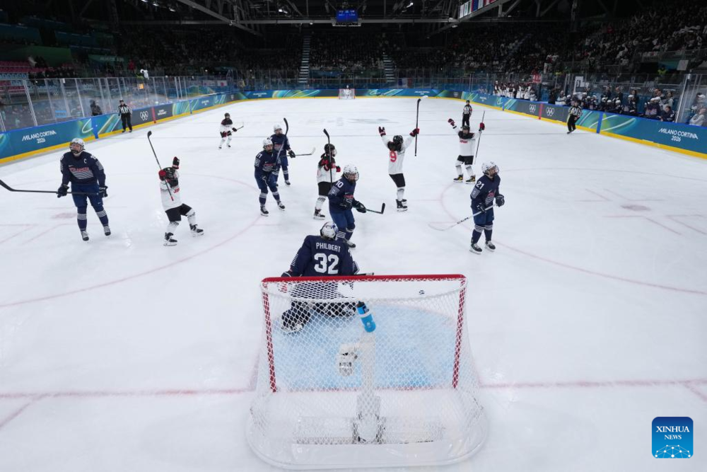 Highlights of Milan-Cortina 2026 on Feb. 6. Images | Players of Japan celebrate a goal during the Women's Preliminary Round Group B match between France and Japan of Ice Hockey of the 2026 Milan-Cortina Olympic Winter Games in Milan, Italy, Feb. 6, 2026. (Zhang Cheng/Pool via Xinhua)