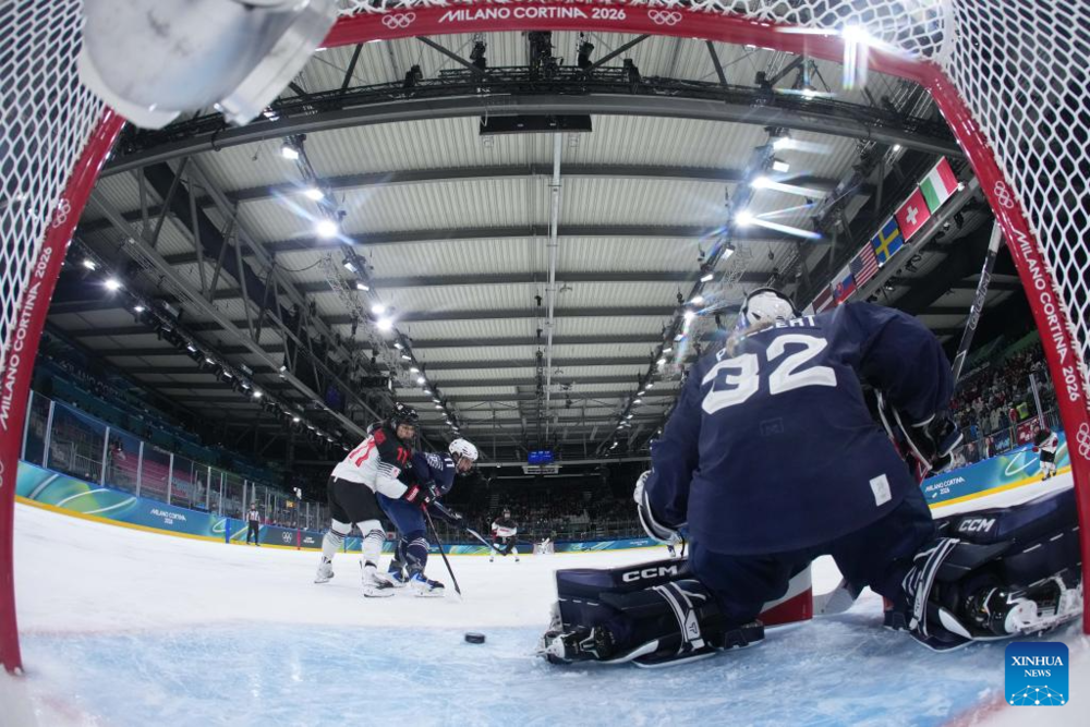 Highlights of Milan-Cortina 2026 on Feb. 6. Images | Goalkeeper Alice Philbert of France saves a goal during the Women's Preliminary Round Group B match between France and Japan of Ice Hockey of the 2026 Milan-Cortina Olympic Winter Games in Milan, Italy, Feb. 6, 2026. (Zhang Cheng/Pool via Xinhua)